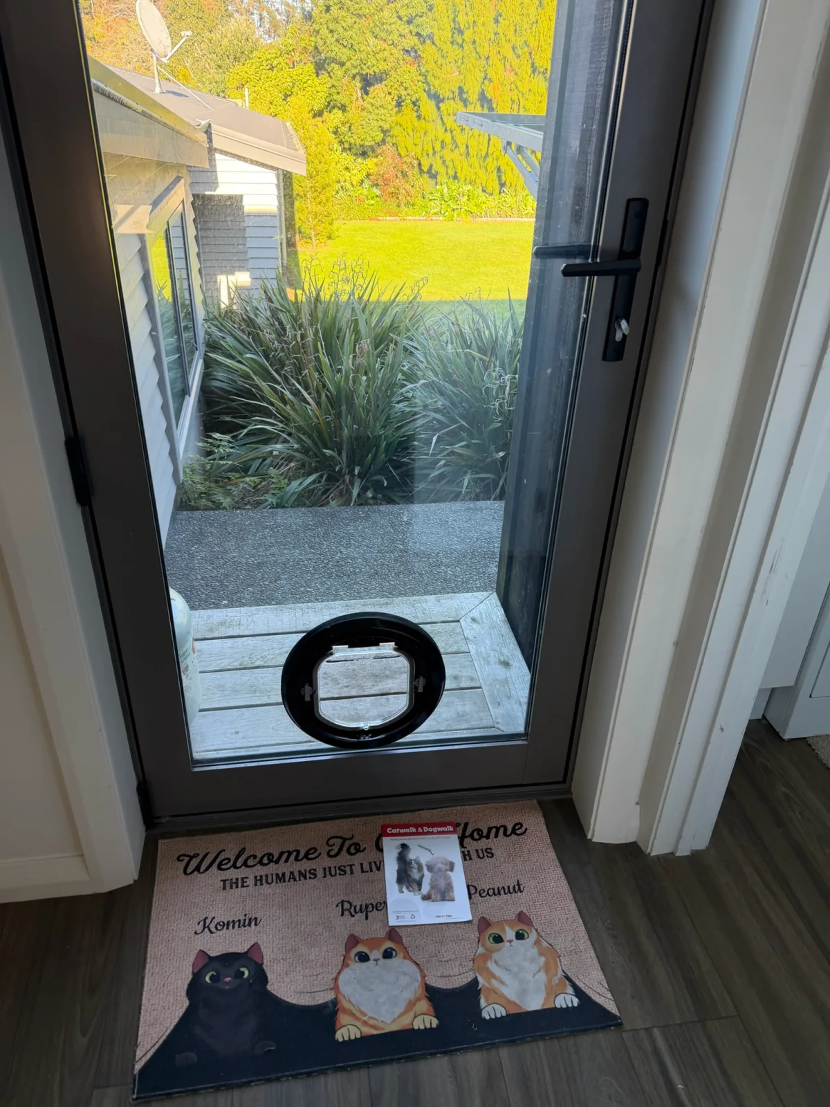 Round pet door installed in a glazed door from the First Glass job-photo archive