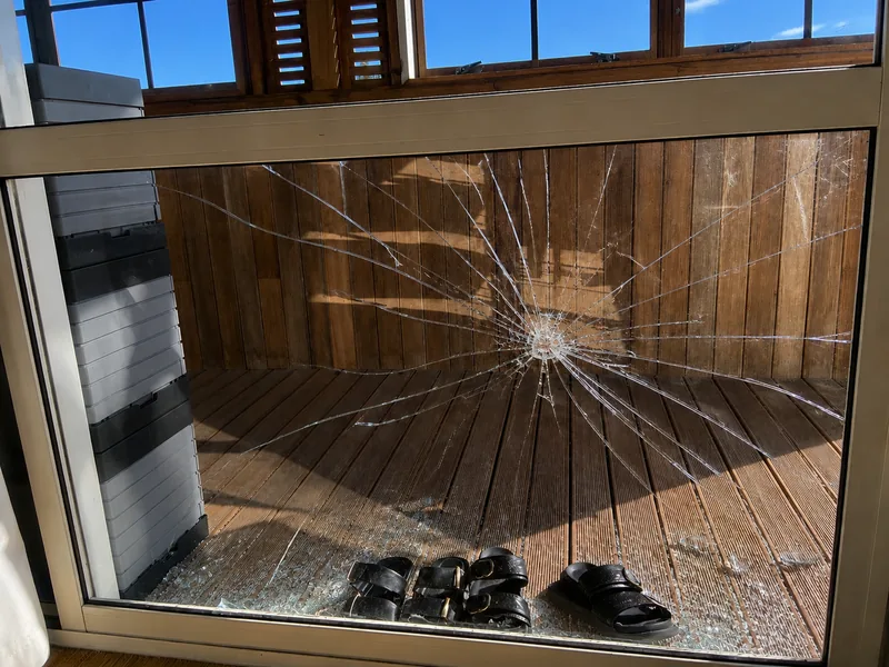 Impact damage across a window pane from the First Glass website repair gallery