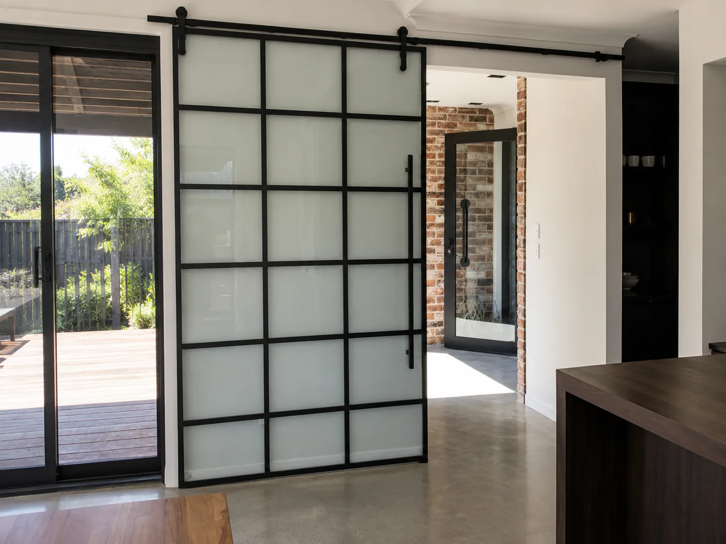 Large custom cut glass panel installed in a home