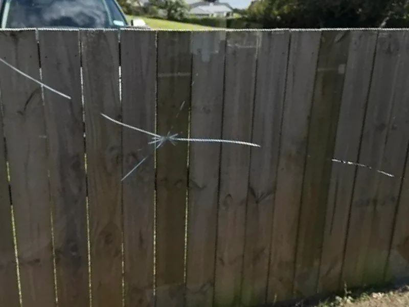 An impact crack starring out across a window pane