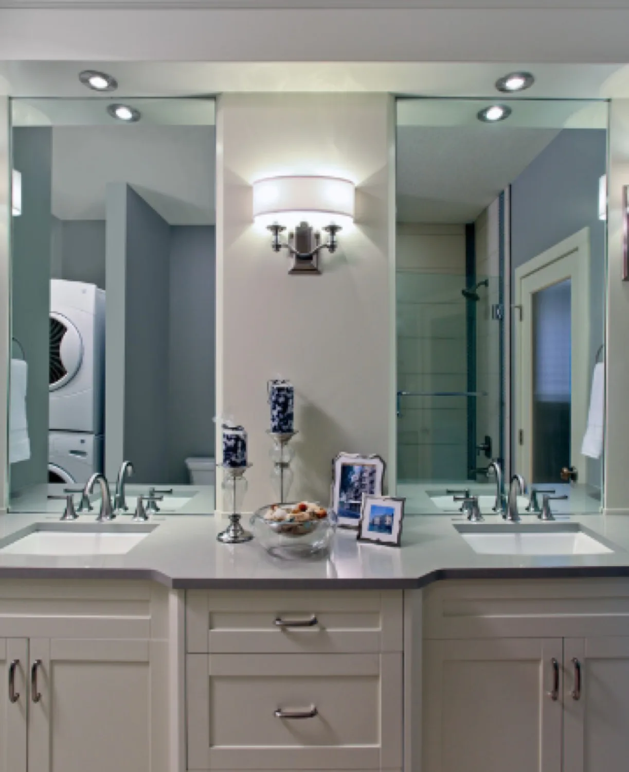 Bathroom mirror installed above a dark vanity