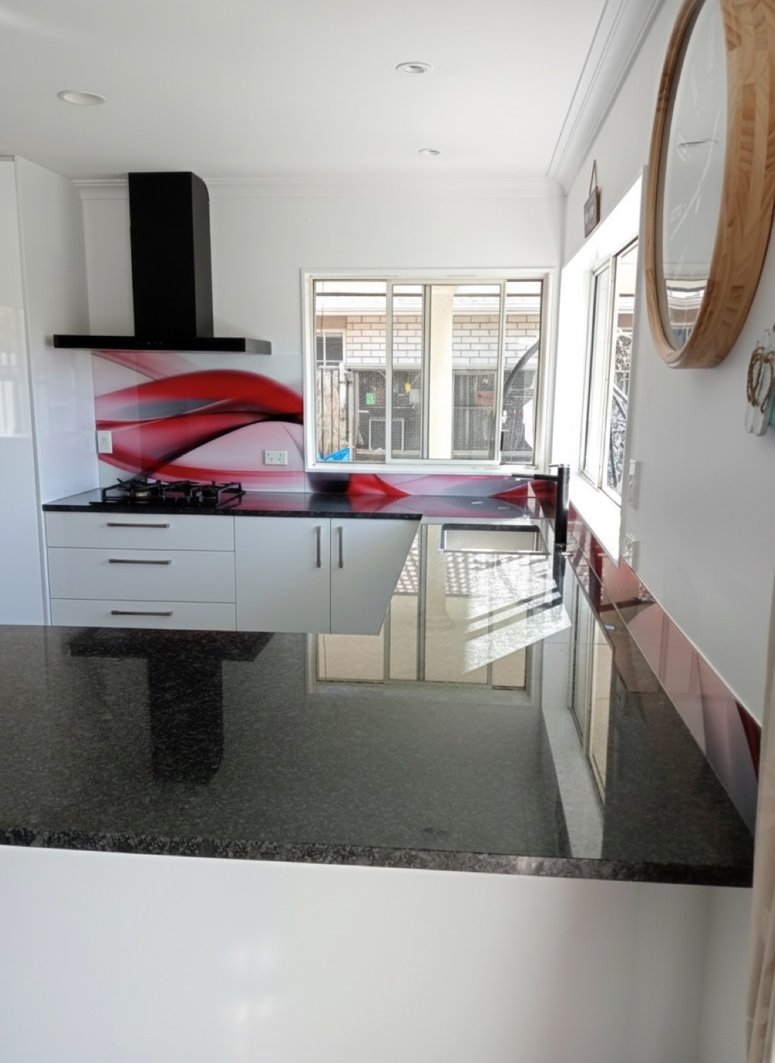 Red wave printed glass splashback in Tauranga
